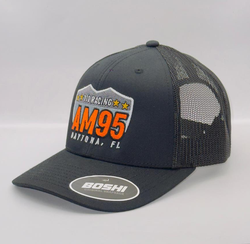 Black and gray cap with orange text on a white background